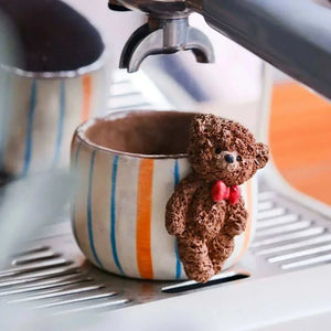 Hand-sculpted ceramic coffee cup from Yifang Artisan Series with whimsical 3D details