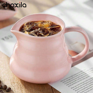 Choxila Origami Series soft pink ceramic coffee dripper and server on natural bamboo tray with geometric design