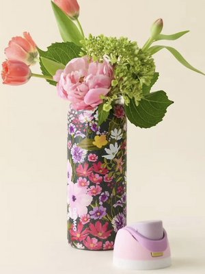 Owala FreeSip UO floral bottle with lid removed holding flowers