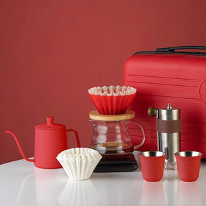 Choxila Red Edition portable travel coffee kit with matte red kettle, manual grinder, digital scale, dripper, glass server, insulated mugs, and hard-shell case
