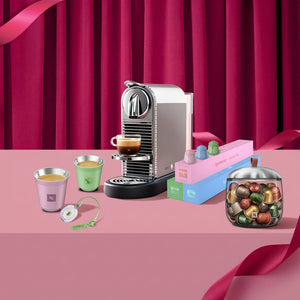 Nespresso Citiz Swarovski Edition promotional banner with machine and gift set including cups and storage jar