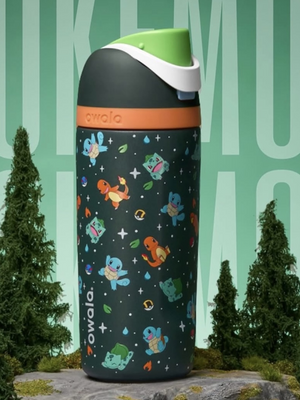 Owala Charizard water bottle in black with orange band and character pattern, front angled view