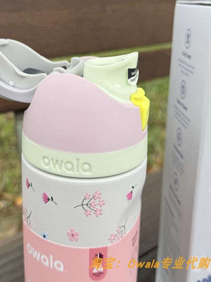 Owala pink floral insulated bottle with carry loop and straw spout