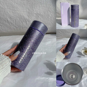 Starbucks cup from Purple Cherry Blossom Collection stainless steel drinkware with floral design and vacuum insulation