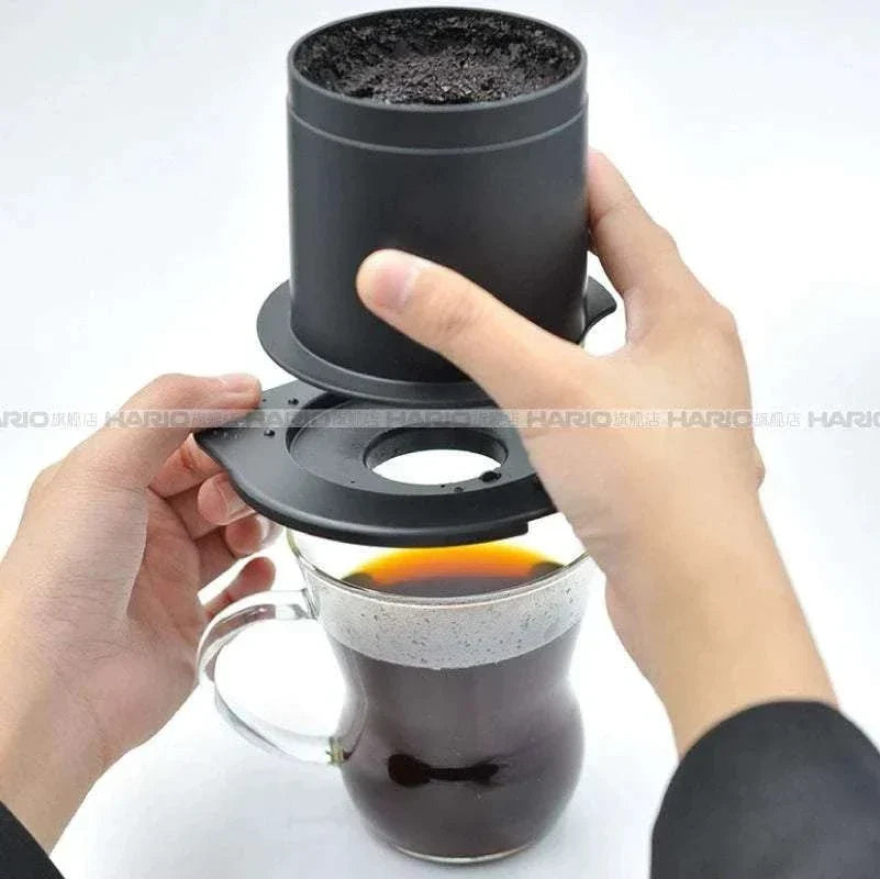 HARIO One-Cup Cafeor stainless steel mesh coffee filter brewing on a ceramic mug