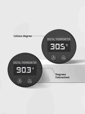 Cup To Machine digital coffee thermometer with frothing clip showing temperature readings on LCD display attached to a milk pitcher