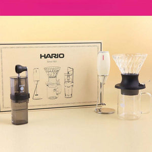 HARIO V60 Smart G coffee starter set with manual grinder, glass dripper, coffee server, and milk frother.