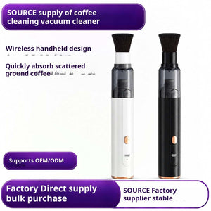 Wireless handheld coffee vacuum cleaner with brush and crevice attachments on desk