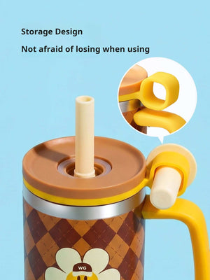 Close-up of the Brown Glasslock x Wiggle Wiggle tumbler showing its lid and straw storage design