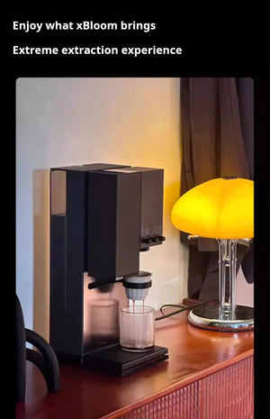 xBloom Studio coffee machine in a cozy home environment with warm ambient lighting.