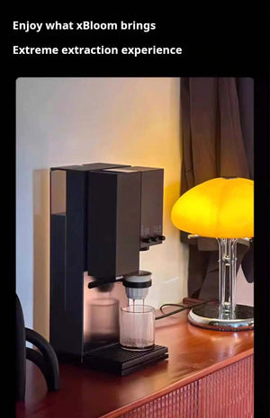 xBloom Studio coffee machine in a cozy home environment with warm ambient lighting.