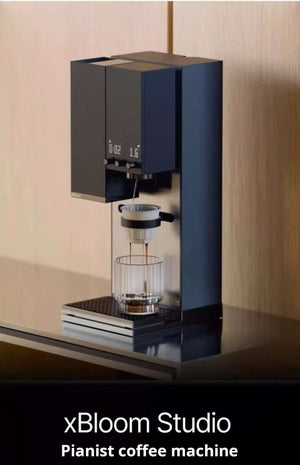 Premium blue xBloom Studio pianist coffee machine displayed on a modern coffee bar.