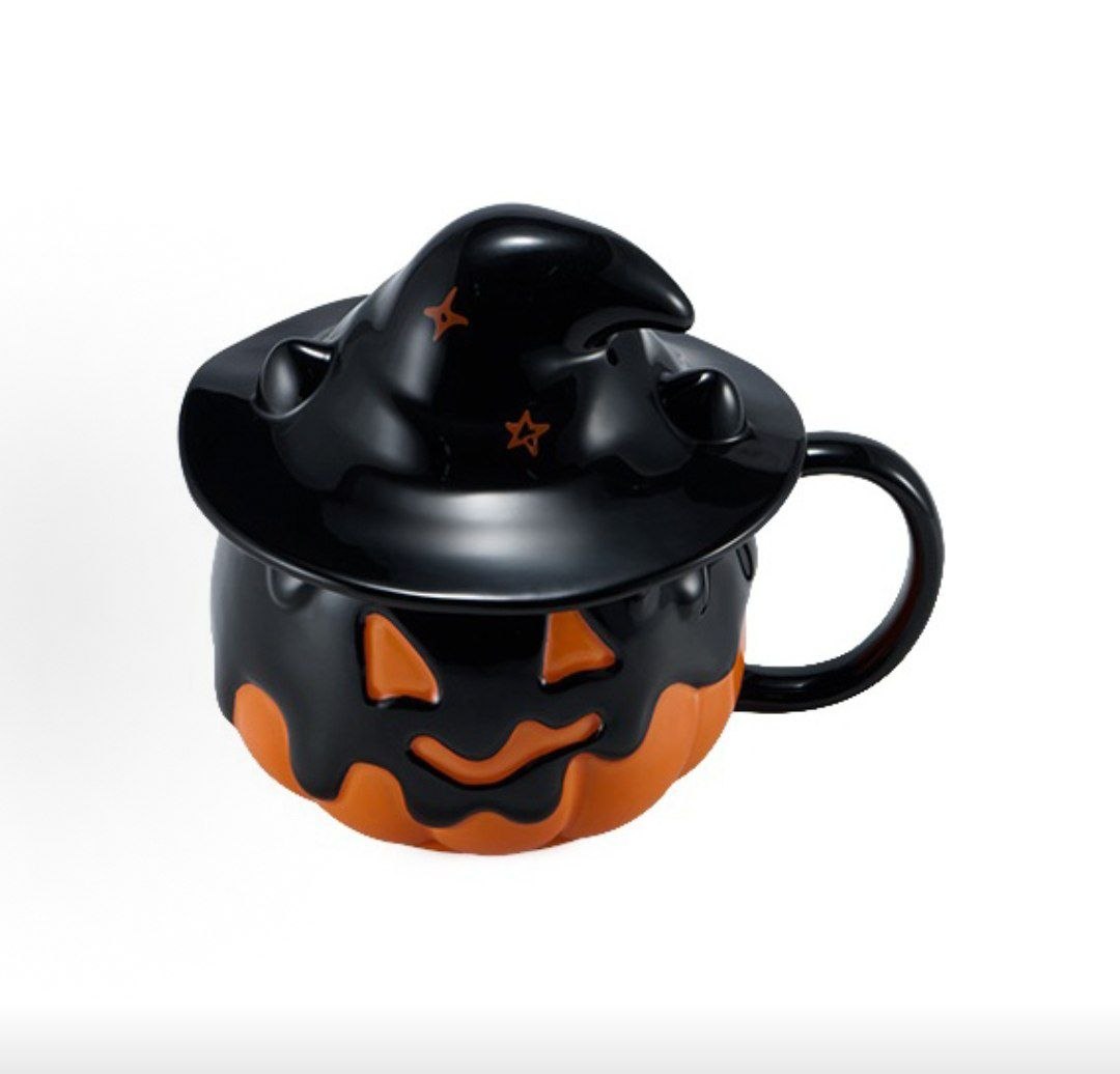 Starbucks halloween pumpkin cup angled view showing handle and face cutouts