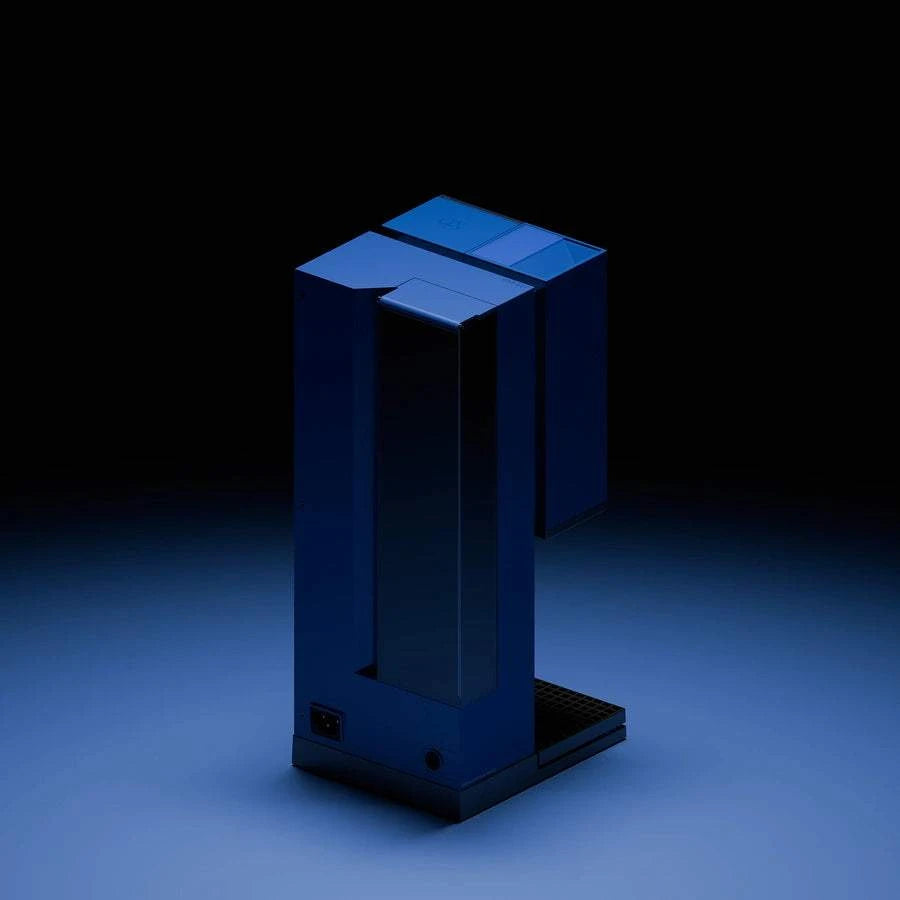 xBloom Studio pour-over coffee machine in blue, back three-quarter view in dark lighting