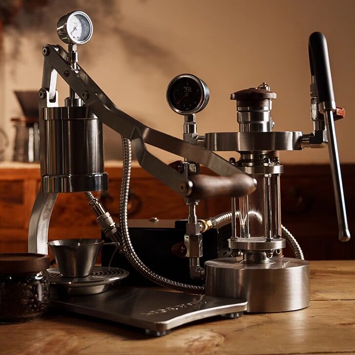 Aleman 2S machine on a wooden surface with a warm background