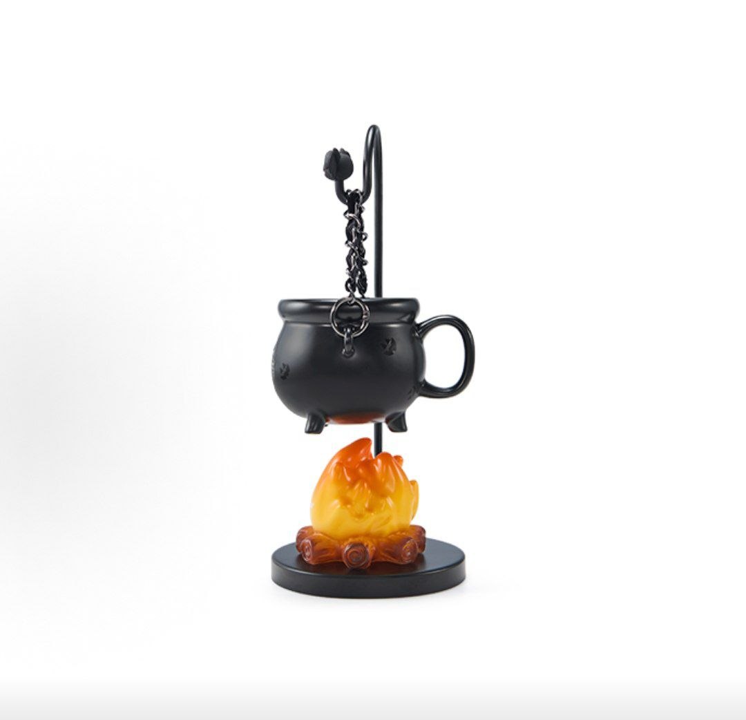 Side view of Halloween cauldron lamp with three-legged pot and chain