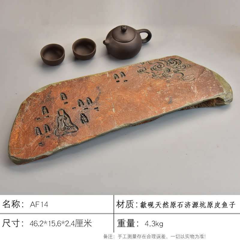 Handcrafted natural stone tea tray with traditional carvings and rustic ochre tones for Gongfu tea ceremony