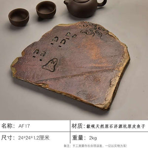 Handcrafted natural stone tea tray with traditional carvings and ochre tones for Gongfu tea ceremony