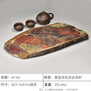 Natural stone tea tray handcrafted from She Yan stone with intricate carvings and rustic ochre tones