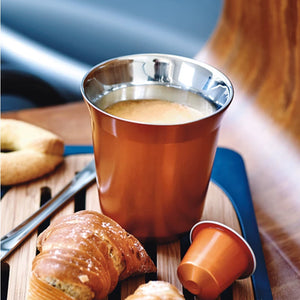 Copper Pixie espresso cup with coffee and pastry on table