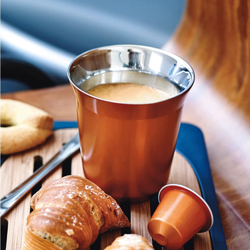 Copper Pixie espresso cup with coffee and pastry on table