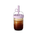 Portable coffee shaker cup held by model in promotional setting