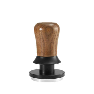 Espresso tamper with walnut wood handle and concentric ripple stainless steel base for even coffee extraction