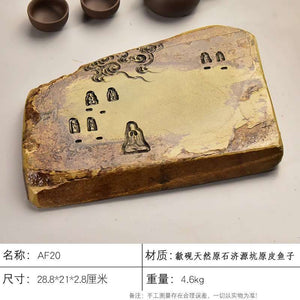Handcrafted natural stone tea tray with intricate carvings and ochre tones for Gongfu tea ceremonies