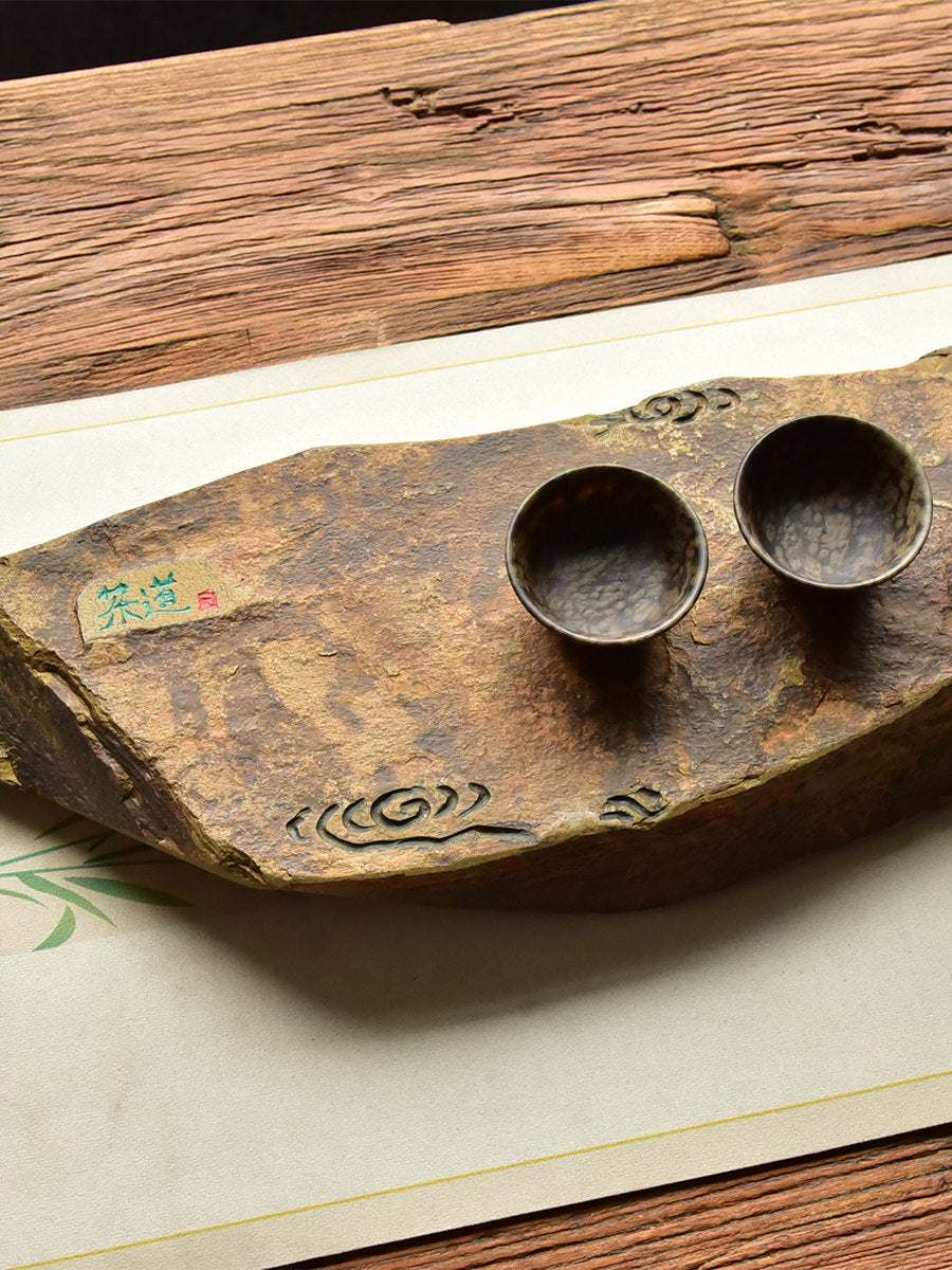 Handcrafted natural stone tea tray with traditional carved motifs for Gongfu tea ceremonies