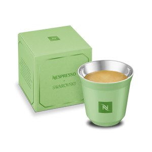 Green Nespresso Swarovski long cup with its box, front view