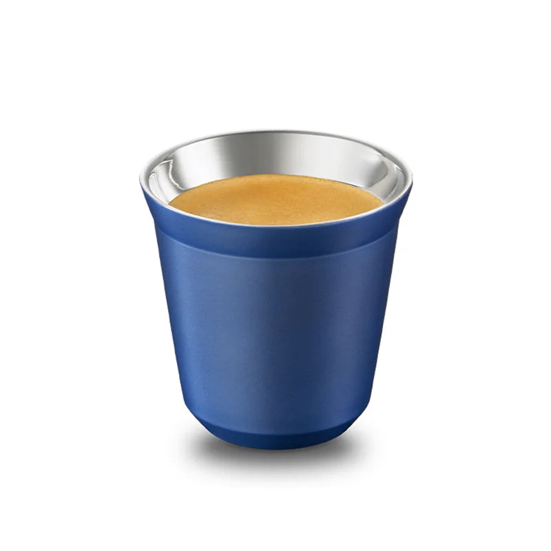 Blue stainless steel espresso cup with coffee, angled view