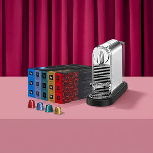 Nespresso Citiz Swarovski Edition promotional banner with platinum machine and coffee capsule boxes
