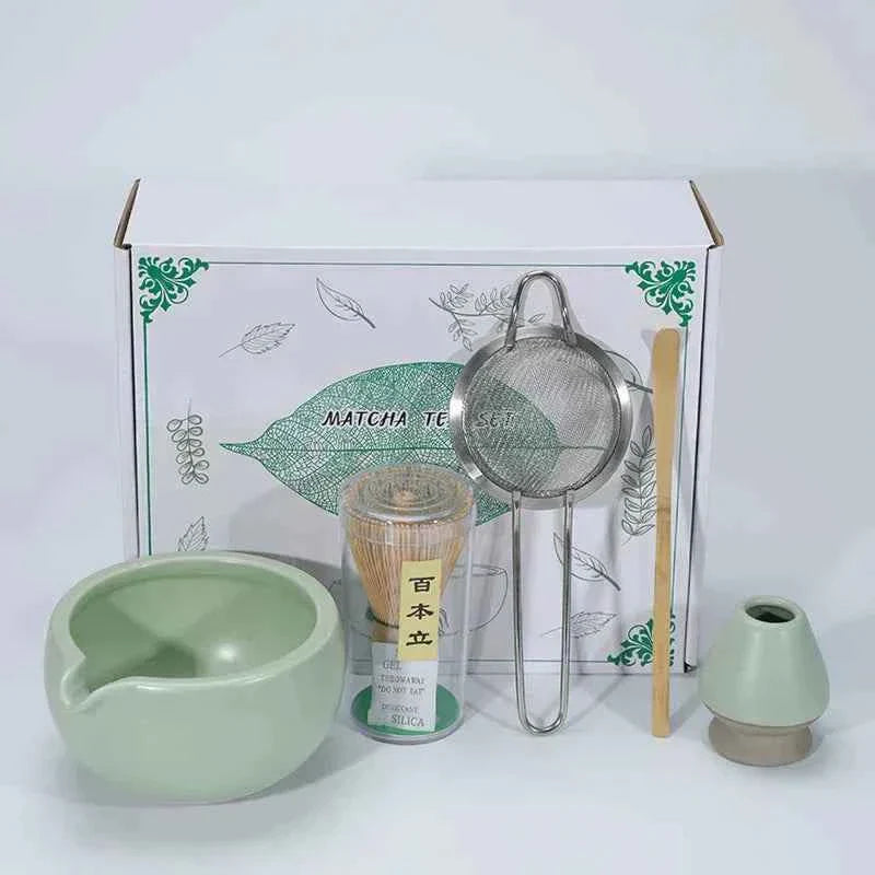 Japanese matcha tea set with ceramic bowl, whisk, sifter, and bamboo scoop.