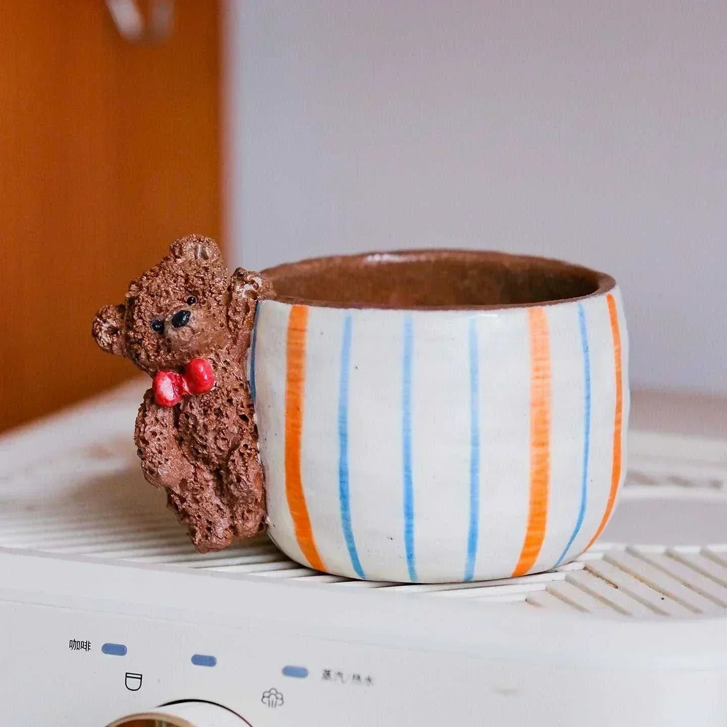 Hand-sculpted ceramic coffee cup Artisan Series with whimsical 3D animal and dancer designs
