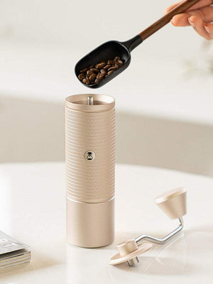 Manual coffee grinder with stainless steel burr and ergonomic handle for precise grinding