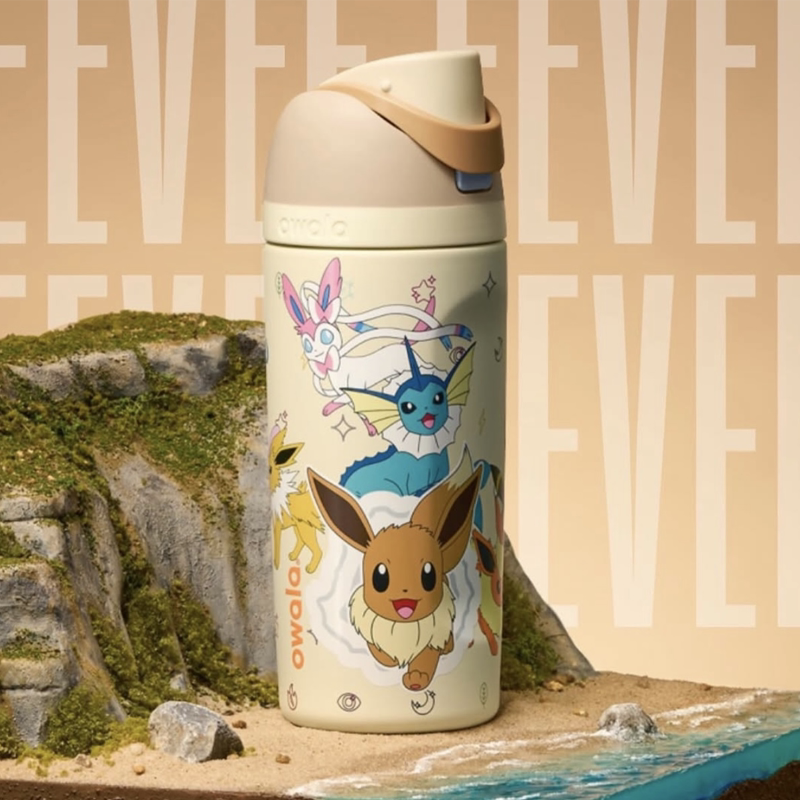 Owala Eevee water bottle in cream with character graphics, front view