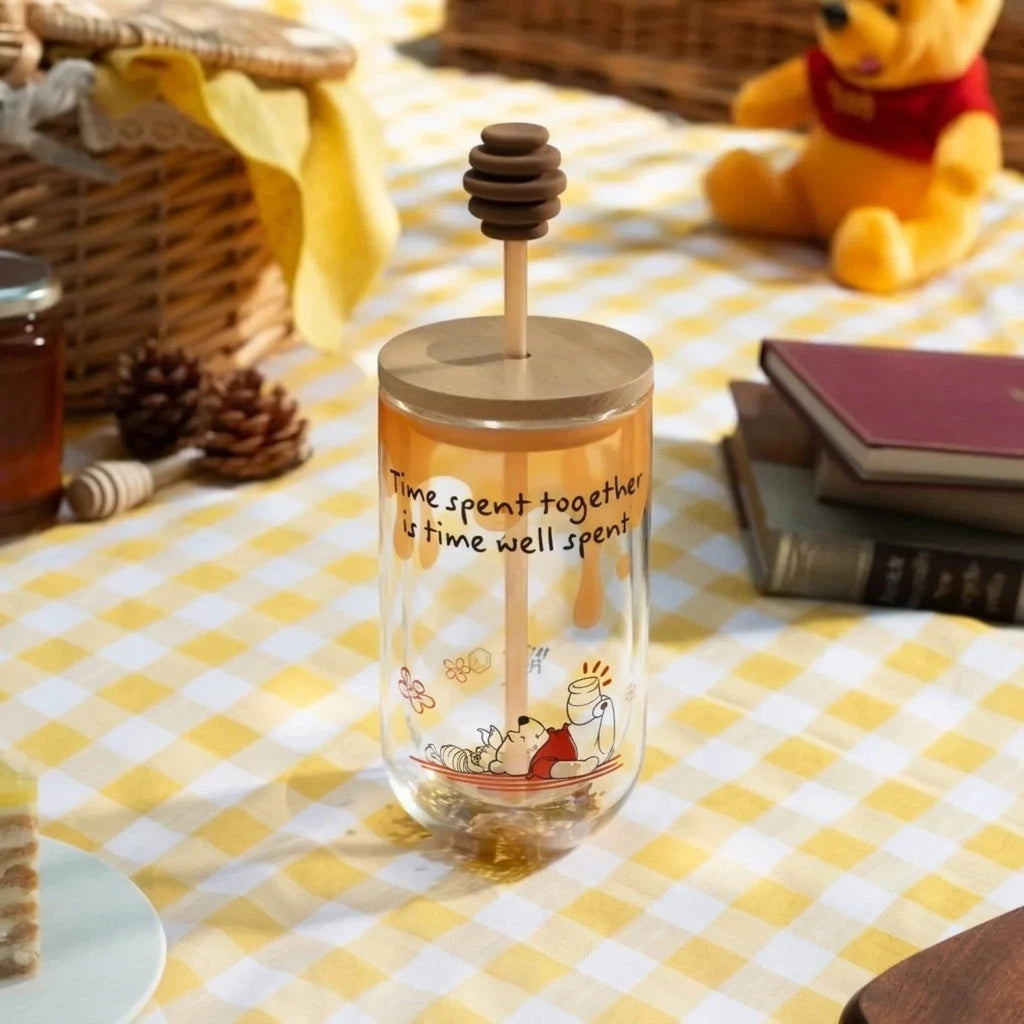 Winnie the Pooh honey cold cup with honey dipper lid and character illustration