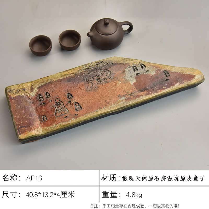Handcrafted natural stone tea tray with traditional She Yan relief carvings and rustic ochre tones