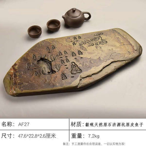 Handcrafted natural stone tea tray with carved meditative designs for Gongfu tea ceremony