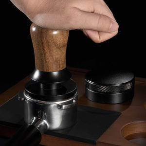 Espresso tamper with walnut wood handle and stainless steel ripple base for even coffee extraction