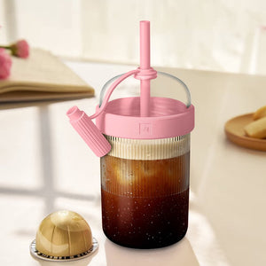 Coffee shaker cup in pink variant with coffee capsule