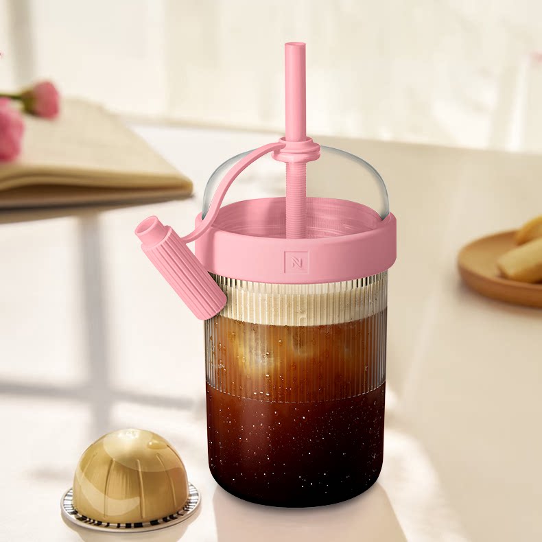 Coffee shaker cup in pink variant with coffee capsule