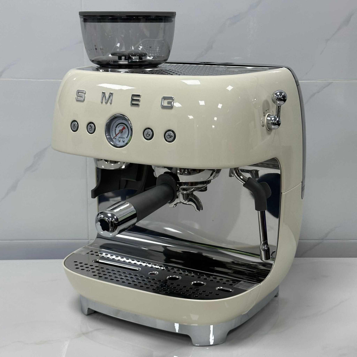 SMEG Espresso Coffee Machine with built-in grinder and milk frother in sleek metal design