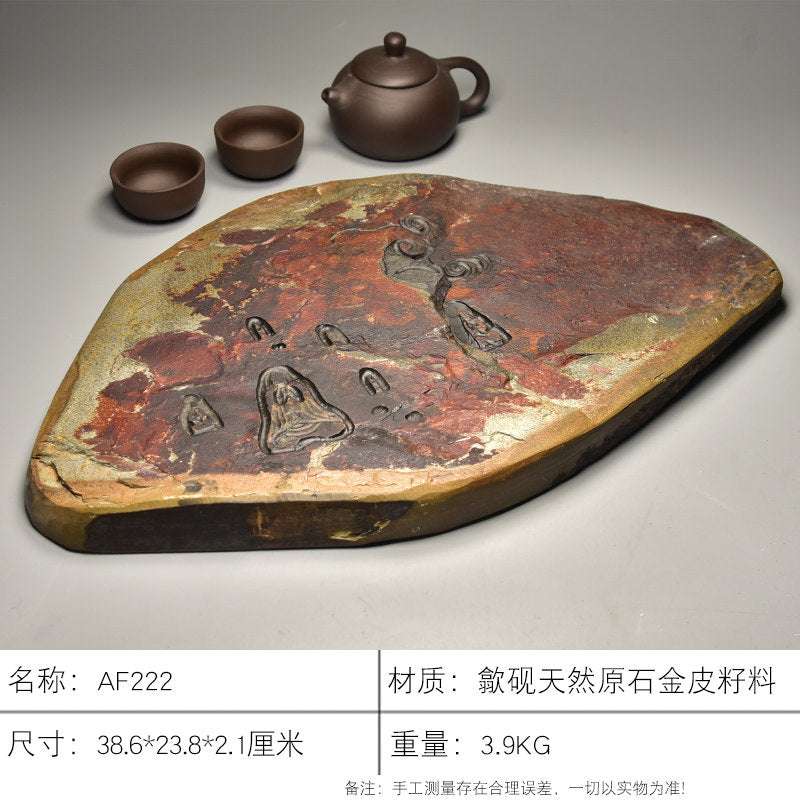 Handcrafted natural stone She Yan Gongfu tea tray with traditional carvings and ochre mineral texture