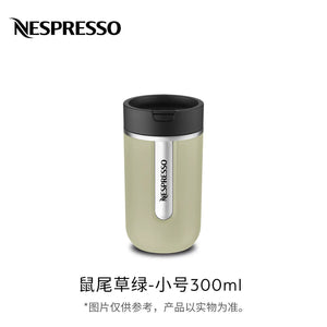 Sage green insulated travel coffee mug, front view