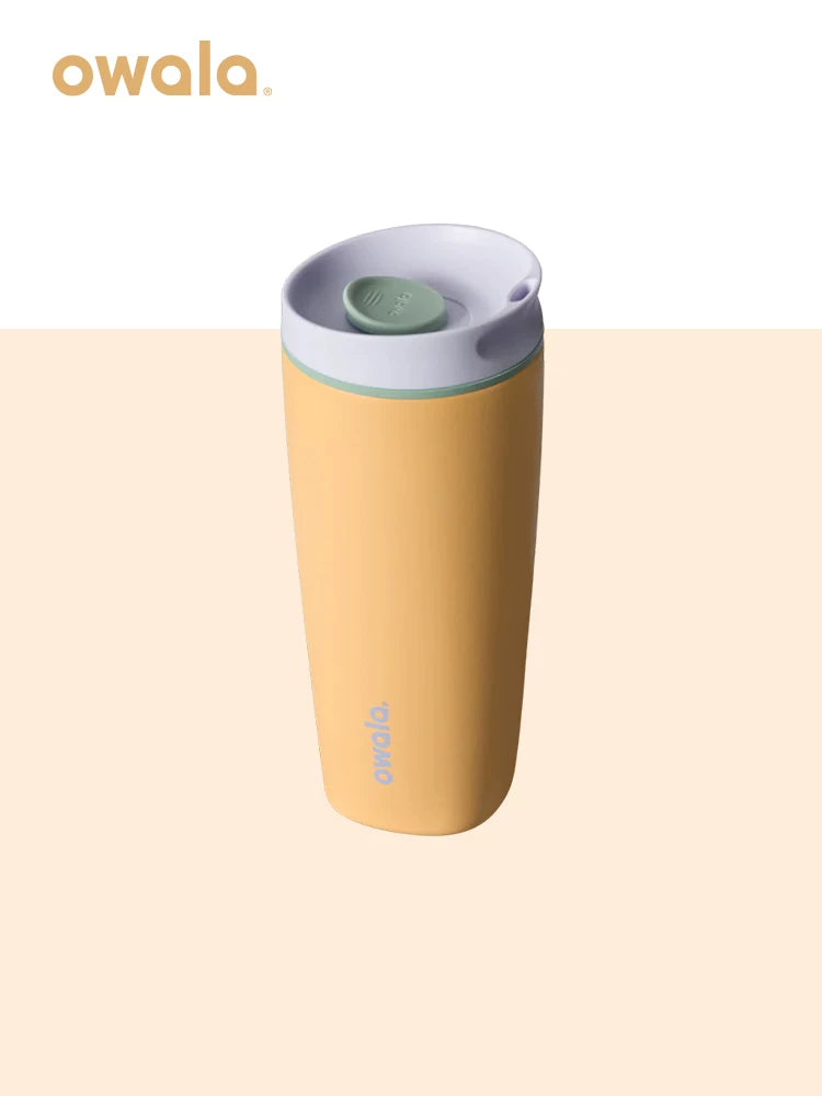 Owala insulated coffee mug in mustard yellow with green lid button, front view