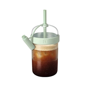 Iced coffee shaker cup in light green on white background