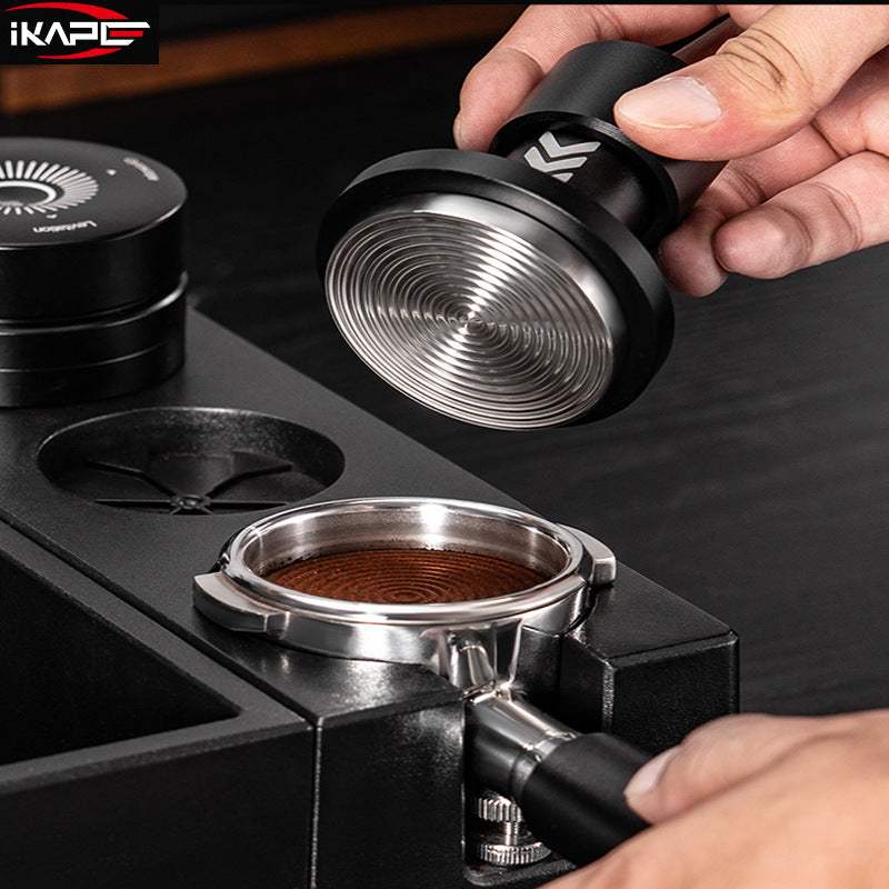 IKAPE Calibrated Impact Espresso Tamper with matte black anodized aluminum handle and stainless steel ripple base for precise espresso tamping