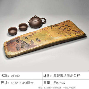 Handcrafted natural stone tea tray with traditional carvings and rustic texture for Gongfu tea ceremony