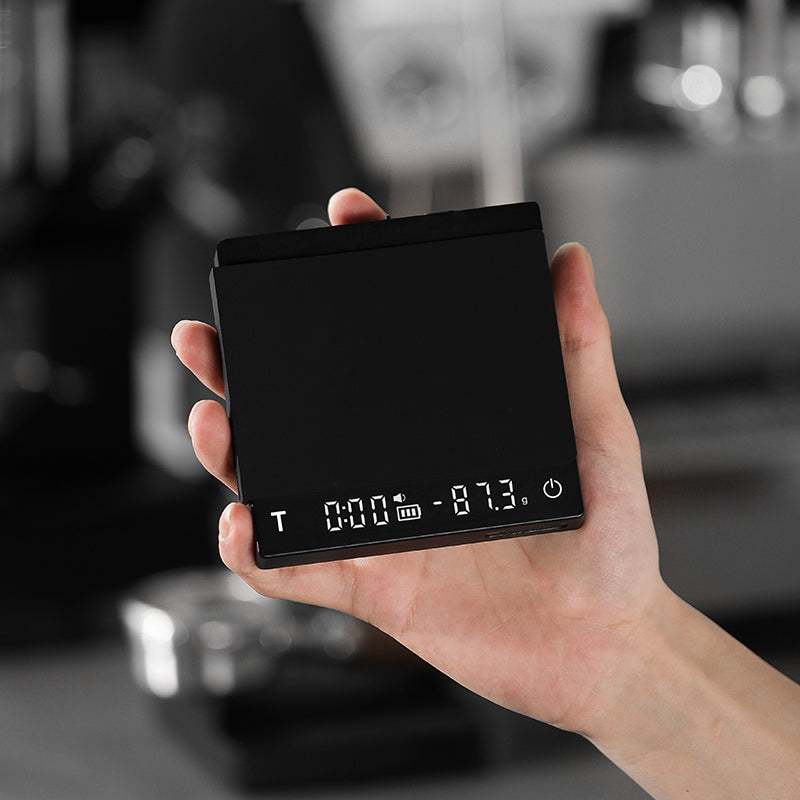 Mini Coffee Scale with Timer digital espresso scale on wooden surface next to coffee accessories